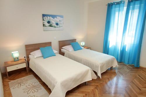 En eller flere senger på et rom på Apartment Biočić