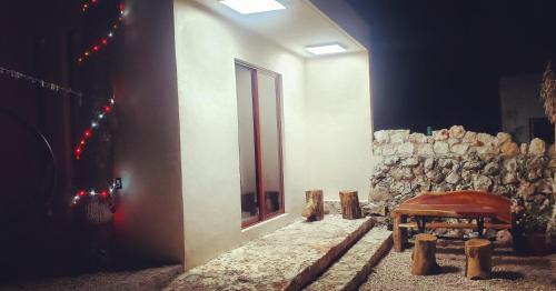 a room with a pile of logs next to a window at Casa los Jarochos in Valladolid