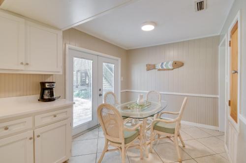 a kitchen with a table and chairs in a kitchen at Waterfront Foley Area Home - 15 Mi to Gulf! in Elberta