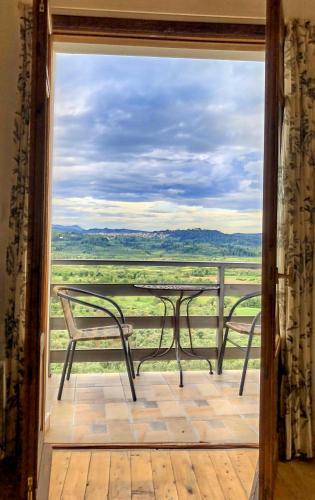 a view of a table and chairs on a balcony at Great Escape Olympia in Olympia