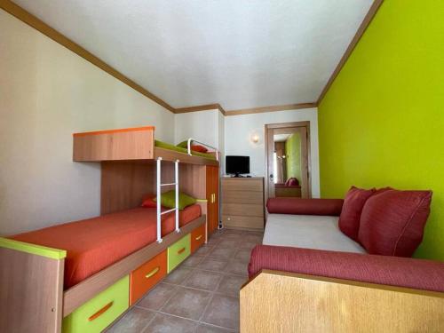 a small room with two bunk beds and a couch at Sesimbra Retreat by the Sea in Sesimbra