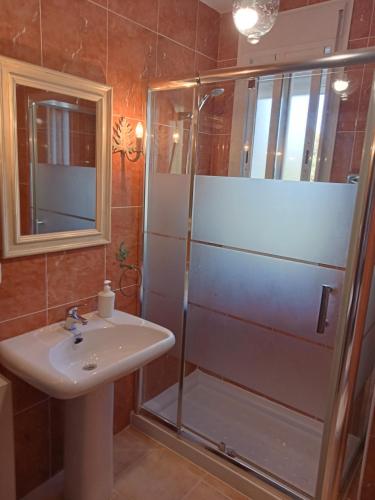 a bathroom with a shower and a sink at Casa Estacion de Benaojan in Benaoján