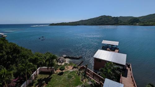 an aerial view of a large body of water at El Palacio Rosa on Blue Lagoon 2BR Beachfront Suite on pristine & quiet bay w incredible views in Arrozal