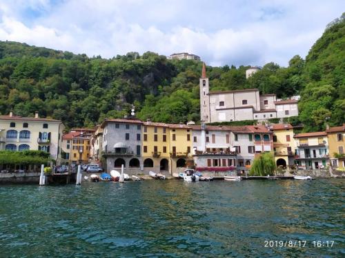 a group of buildings next to a body of water at Casa Orchidea in Oria