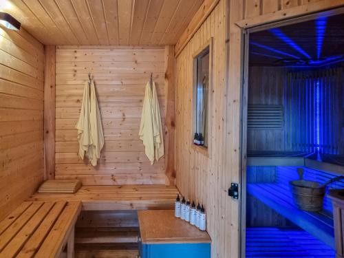 a wooden cabin with a sauna at Domki Letniskowe in Grzybowo