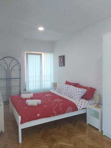 Postel nebo postele na pokoji v ubytování Apartmani Sladojević