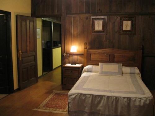 a bedroom with a bed and a sink in it at camino de santiago in Forcarei