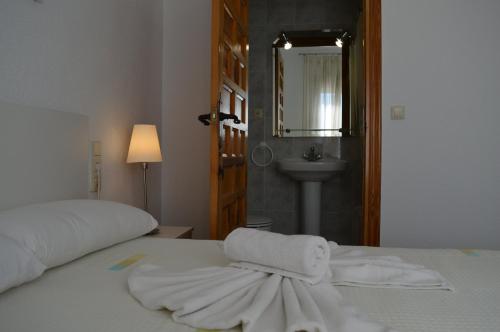 Ένα ή περισσότερα κρεβάτια σε δωμάτιο στο Nuevo Hotel Capitolio