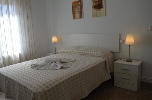Ένα ή περισσότερα κρεβάτια σε δωμάτιο στο Nuevo Hotel Capitolio