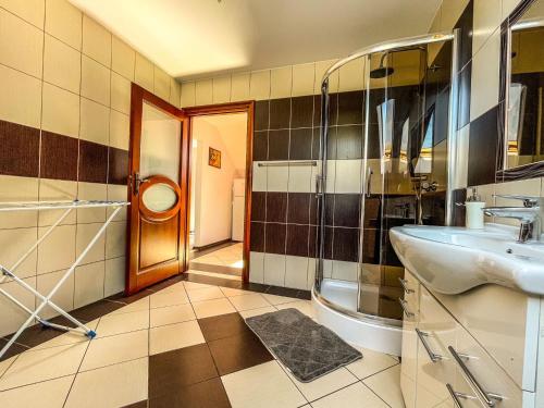 a bathroom with a sink and a toilet at Agroturystyka"u Piwowara" in Kłodzko