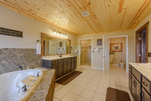 a large bathroom with a tub and a sink at Bear The View in Seven Devils