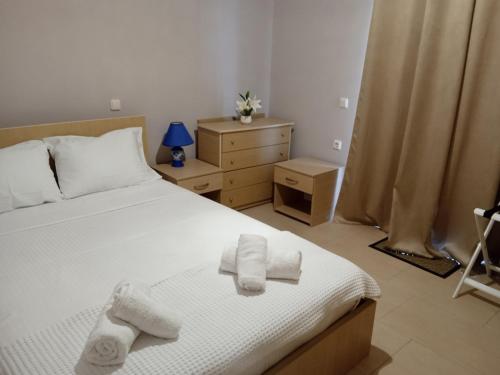 Ένα ή περισσότερα κρεβάτια σε δωμάτιο στο Villa Katherine Laganas