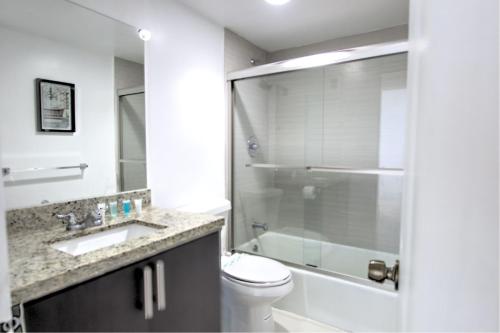 a bathroom with a toilet and a sink and a shower at Miami Hollywood Gorgeous 2BD Awesome Ocean View in Hollywood