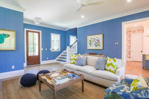 a blue living room with a couch and a table at Whispering Palms in Seabrook Island
