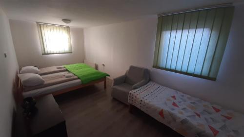 Postel nebo postele na pokoji v ubytování Apartman TATTOO R LUX