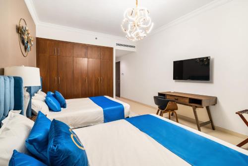 Ένα ή περισσότερα κρεβάτια σε δωμάτιο στο Amazing BeachFront Apartments near Atlantis Waterpark by Simply Comfort Sarai Palm Jumeirah