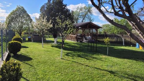 a park with a gazebo in the grass at Dana's House in Râşnov
