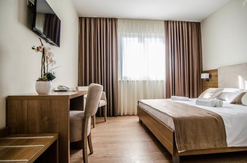 Postel nebo postele na pokoji v ubytování Villa Ruža