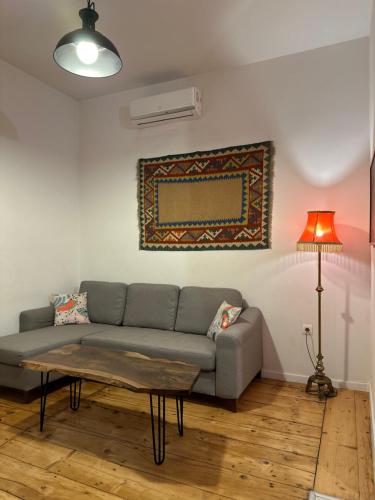 a living room with a couch and a table at Salalak in Tbilisi City