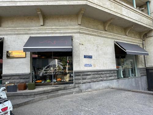 a store front of a building with an awning at Salalak in Tbilisi City