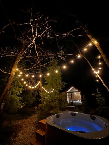 Φωτογραφία από το άλμπουμ του Odpoczynek Domki Pod Dębem z Opcją Jacuzzi σε Ćmińsk