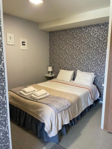 Ένα ή περισσότερα κρεβάτια σε δωμάτιο στο Liber Guest House