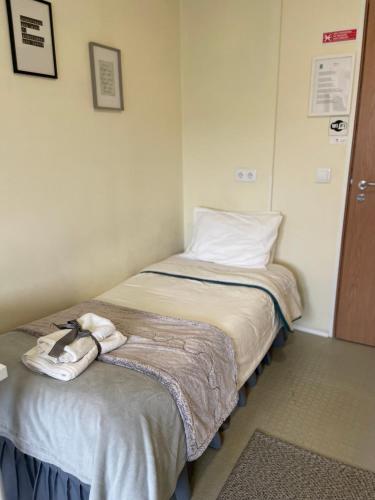 Ένα ή περισσότερα κρεβάτια σε δωμάτιο στο Liber Guest House