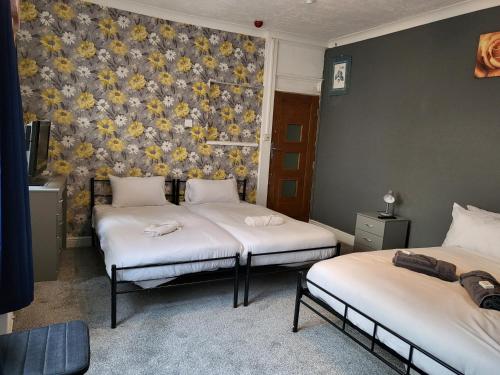 Ένα ή περισσότερα κρεβάτια σε δωμάτιο στο Tulip Hotel Blackpool