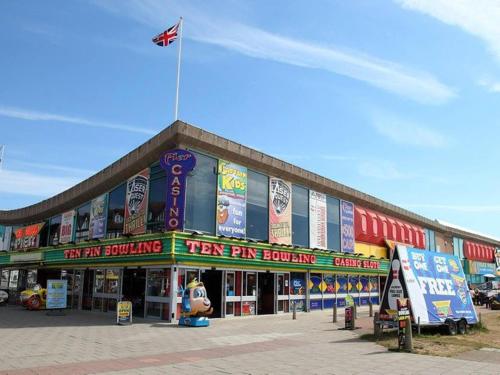 a large building with a flag on top of it at Idyllic Family Holiday Caravan in Skegness