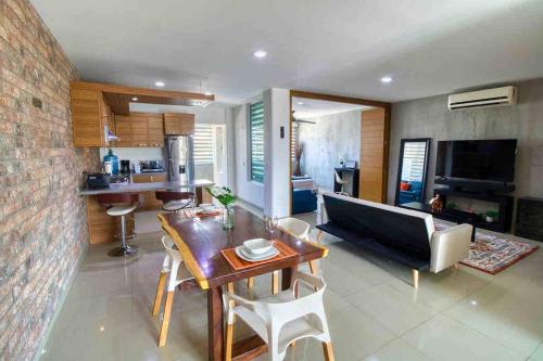 a living room with a table and a couch at 2 bd Loft in Versalles, Walk to the Beach! in Puerto Vallarta