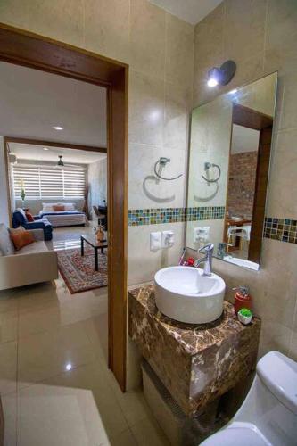 a bathroom with a sink and a mirror at 2 bd Loft in Versalles, Walk to the Beach! in Puerto Vallarta