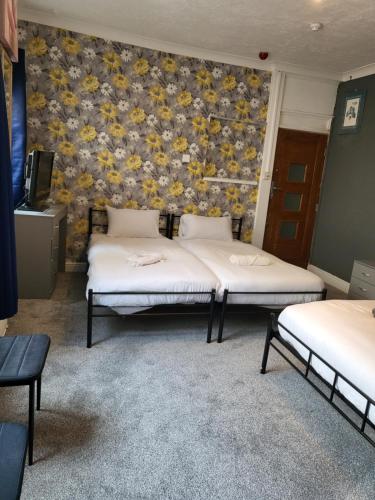 Ένα ή περισσότερα κρεβάτια σε δωμάτιο στο Tulip Hotel Blackpool
