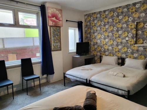 Ένα ή περισσότερα κρεβάτια σε δωμάτιο στο Tulip Hotel Blackpool