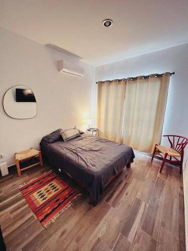 a bedroom with a bed and a table and chairs at Excelente Casa en Zona de Cerritos en Frente a Alberca - Azul Pacífico I in Mazatlán