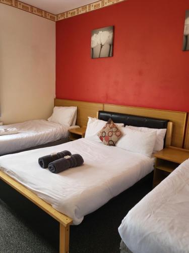 Ένα ή περισσότερα κρεβάτια σε δωμάτιο στο Tulip Hotel Blackpool
