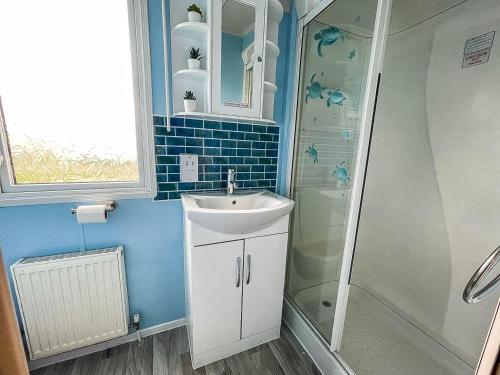 a bathroom with a sink and a shower at Modern 6 Berth Caravan For Hire At Fantasy Island In Skegness Ref 58009d in Skegness