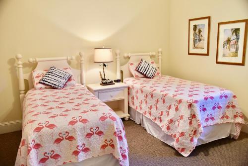 two beds sitting next to each other in a bedroom at Holiday Isle 221 in Dauphin Island