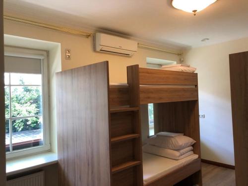 a bunk bed in a room with a window at Bed&Blues in Vilnius