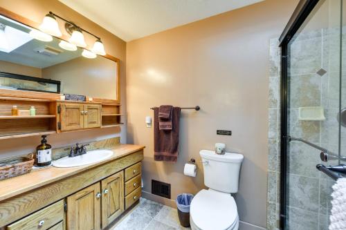 a bathroom with a shower and a toilet and a sink at Pollock Pines Resort Cabin 11 Mi to Apple Hill in Pollock Pines