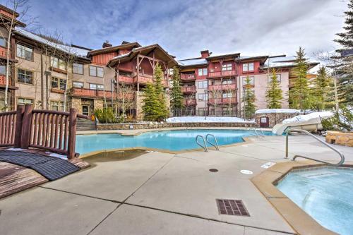 a swimming pool in front of a apartment building at Ski-InandSki-Out Solitude Resort Condo with Mtn Views! in Solitude