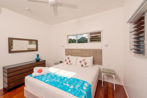 Ένα ή περισσότερα κρεβάτια σε δωμάτιο στο Crystal Blue Lagoon Villas