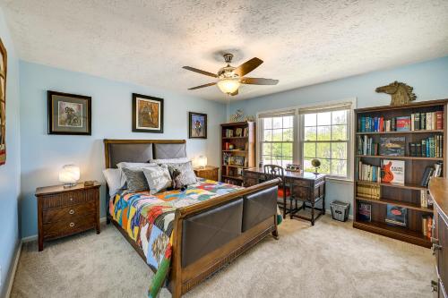 a bedroom with a bed and a ceiling fan at Cozy Lexington Townhome about 3 Mi to UK Campus! in Lexington