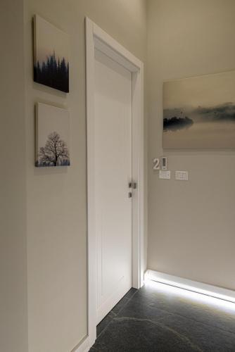 a door in a room with two pictures on the wall at VIVI A NAPOLI in Naples