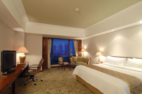 Ένα ή περισσότερα κρεβάτια σε δωμάτιο στο The Sultan Hotel & Residence Jakarta