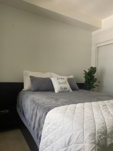 a bedroom with a bed with pillows on it at Luxury Apartment in Downtown Las Vegas in Las Vegas