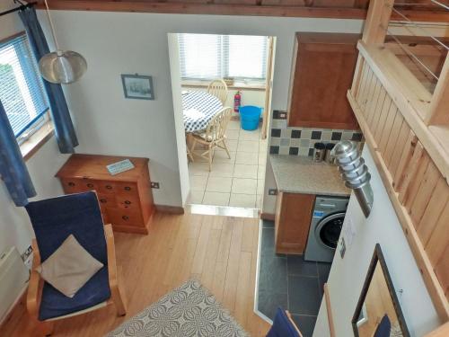 an overhead view of a kitchen and a living room at The Studio in Lochmaddy