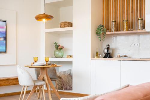 a living room with a small table and chairs at Coimbra Premium Downtown in Coimbra