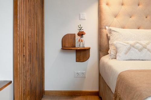 Ένα ή περισσότερα κρεβάτια σε δωμάτιο στο Coimbra Premium Downtown