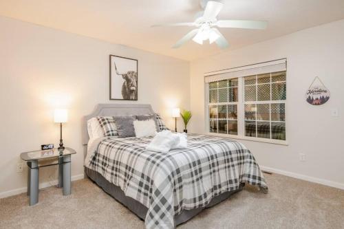 a bedroom with a bed and a ceiling fan at Great Smoky Mountain Get-Away in Pigeon Forge
