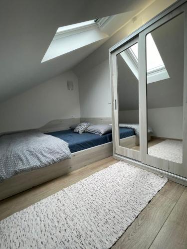 a bedroom with a bed and a large window at Family friendly house with a swimming pool Mijaca, Zagora - 21267 in Vrgorac